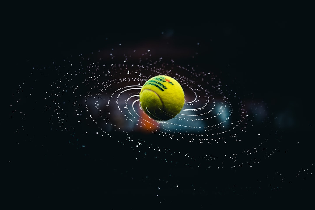 green-and-yellow-ball-on-water-7cmkub9ev90